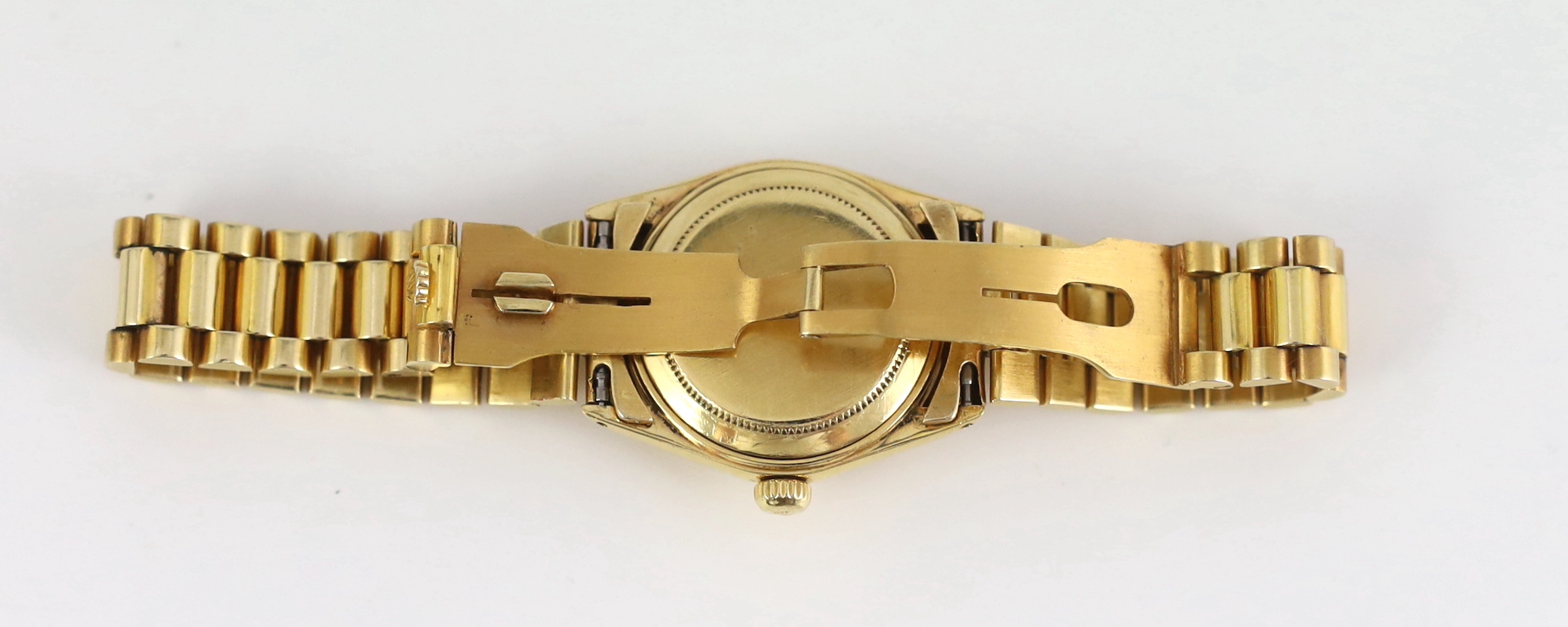 A lady's early 1970's 18ct gold Rolex Oyster Perpetual Datejust wrist watch, with diamond dot numerals, on an 18ct gold Rolex bracelet, with deployment clasp